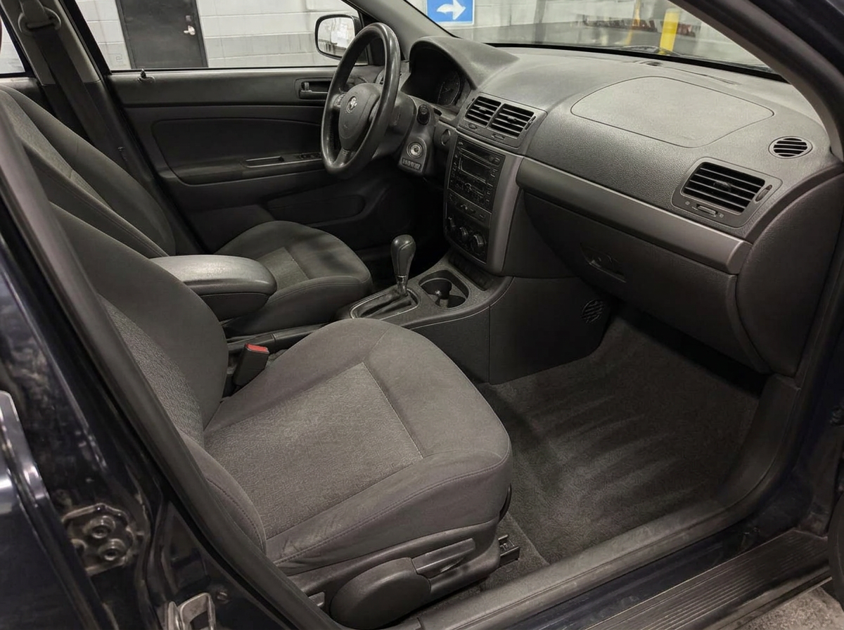 Same cabin after full interior detailing: clean carpet and dust-free plastics